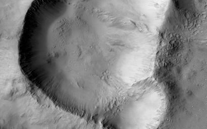 This image from NASA's Mars Mars Reconnaissance Orbiter shows a triple impact crater in Elysium Planitia near Tartarus Montes, which probably formed when a binary-or even triple-asteroid struck the surface.