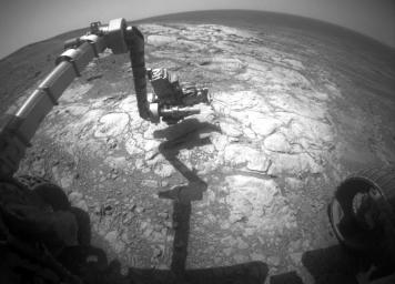 NASA's Mars Exploration Rover Opportunity has extended its robotic arm for studying a light-toned rock target called 'Athens' in this March 25, 2015, image from the rover's front hazard avoidance camera.