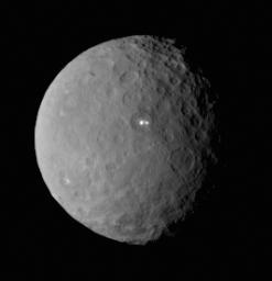 This image was taken by NASA's Dawn spacecraft of dwarf planet Ceres on Feb. 19 from a distance of nearly 29,000 miles (46,000 kilometers). It shows that the brightest spot on Ceres has a dimmer companion, which apparently lies in the same basin.