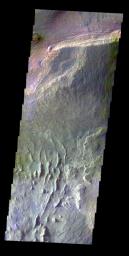 The THEMIS VIS camera contains 5 filters. The data from different filters can be combined in multiple ways to create a false color image. This false color image from NASA's 2001 Mars Odyssey spacecraft shows part of Ceti Mensa in Candor Chasma.