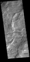 This image of Terra Cimmeria captured by NASA's 2001 Mars Odyssey spacecraft shows two channels intersecting to become one larger channel.