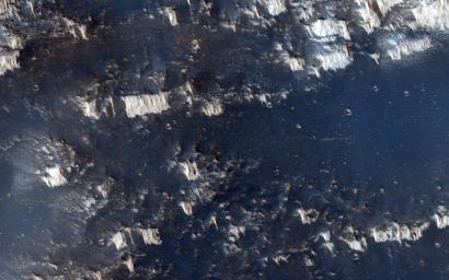 The terrain in this observation from NASA's Mars Reconnaissance Orbiter looks like an ancient uplifted crustal block. The area is riddled with faults (big cracks that allow rocks to slide) and ridges that look like uncovered magma dikes.