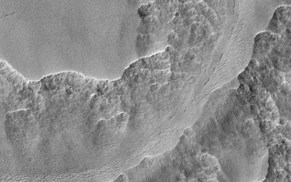 In this observation from NASA's Mars Reconnaissance Orbiter made for a study of ancient craters, we see the craters filled with smooth material that has subsequently degraded into scallops. These formations might be possibly due to ground ice sublimation.