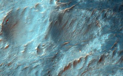 Bigbee is a 21 kilometer-diameter impact crater located on the northern rim of Holden crater in southern Margaritifer Terra, a region on Mars that is well known for its long record of water-rich activity as seen by NASA's Mars Reconnaissance Orbiter.