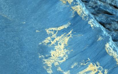 This image from NASA's Mars Reconnaissance Orbiter shows some striking dark downslope flows in Aram Chaos.