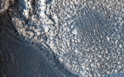 This highly tectonized terrain (meaning it possesses many faults), as seen by NASA's Mars Reconnaissance Orbiter, has its low-lying areas filled with some form of younger material.