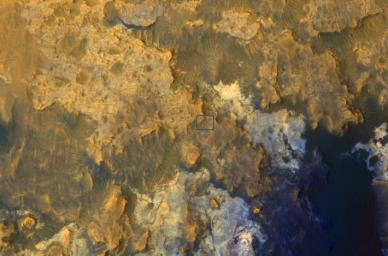 A view from NASA's Mars Reconnaissance Orbiter on April 8, 2015, catches sight of NASA's Curiosity Mars rover passing through a valley called 'Artist's Drive' on the lower slope of Mount Sharp.
