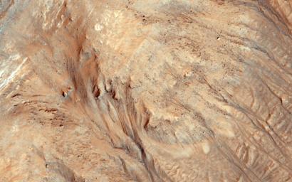 Ravines (or very large gullies) are actively forming on Mars during the coldest times of year, when carbon dioxide frost aids mass wasting as seen by NASA's Mars Reconnaissance Orbiter.