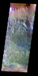 The THEMIS VIS camera contains 5 filters. The data from different filters can be combined in multiple ways to create a false color image. This false color image from NASA's 2001 Mars Odyssey spacecraft shows part of the northern wall of Candor Chasma.