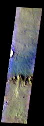 The THEMIS VIS camera contains 5 filters. The data from different filters can be combined in multiple ways to create a false color image. This image from NASA's 2001 Mars Odyssey spacecraft shows part of the crater rim and floor of Flaugergues Crater.