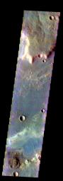 The THEMIS VIS camera contains 5 filters. The data from different filters can be combined in multiple ways to create a false color image. This image from NASA's 2001 Mars Odyssey spacecraft shows part of a linear depression in the plains of Terra Sabaea.
