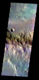 The THEMIS VIS camera contains 5 filters. Data from different filters can be combined in multiple ways to create a false color image. This image from NASA's 2001 Mars Odyssey spacecraft shows the rim and floor of an unnamed crater in Terra Cimmeria.