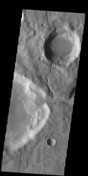 This image from NASA's 2001 Mars Odyssey spacecraft shows two channels. The channel in the center of the image ends in a crater, where it has created a delta deposit. These craters and channels are located on the northeastern margin of Icaria Planum.