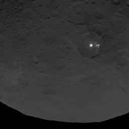 A cluster of mysterious bright spots on dwarf planet Ceres can be seen in this image, taken by NASA's Dawn spacecraft on June 9, 2015.