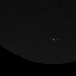 This image of dwarf planet Ceres, taken by NASA's Dawn spacecraft on June 15, 2015, shows a cluster of mysterious spots that are clearly brighter than their surroundings. Dawn took this image at an altitude of 2,700 miles (4,400 kilometers).