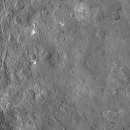This image, taken on June 6, 2015 by NASA's Dawn spacecraft, shows a mountain on Ceres at center-left that is 4 miles (6 kilometers) high, from an altitude of 2,700 miles (4,400 kilometers) with a resolution of 1,400 feet (410 meters) per pixel.