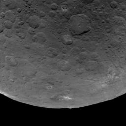 This image of Ceres, taken by NASA's Dawn spacecraft, features several craters with bright material within and around them. The image is centered on terrain near the equator of Ceres and faces southeast.