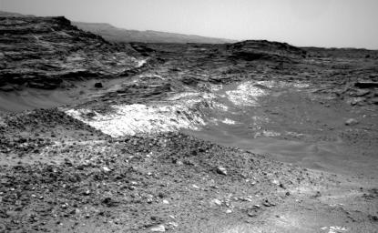 The Martian outcrop where pale rock meets darker overlying rock near the middle of this view from NASA's Curiosity Mars rover is an example of a geological contact. It was taken with the rover's Navcam on May 21, 2015.