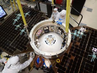 This photo shows the upper side of the cruise stage of NASA's InSight spacecraft as specialists at Lockheed Martin Space Systems, Denver, attach it to the spacecraft's back shell. The photo was taken on April 29, 2015.