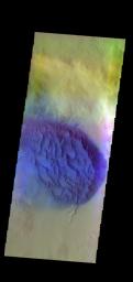 The THEMIS VIS camera contains 5 filters. Data from different filters can be combined in many ways to create a false color image. This image from NASA's 2001 Mars Odyssey spacecraft shows a sand sheet with surface dune forms in an unnamed crater.