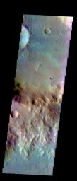 The THEMIS VIS camera contains 5 filters. Data from different filters can be combined in many ways to create a false color image. This image from NASA's 2001 Mars Odyssey spacecraft shows a rim of material between two unnamed craters in Tyrrhena Terra.