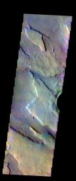 The THEMIS VIS camera contains 5 filters. The data from different filters can be combined in multiple many ways to create a false color image. This image from NASA's 2001 Mars Odyssey spacecraft shows the edge of the northwestern flank of Tyrrhenus Mons.