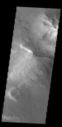 This image captured by NASA's 2001 Mars Odyssey spacecraft shows part of the floor of Melas Chasma, which is part of the much larger Valles Marineris.