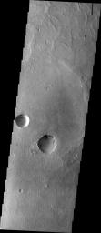 This image captured by NASA's 2001 Mars Odyssey spacecraft shows a part of the flat terrain of northern Meridiani Planum.