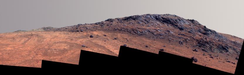 This enhanced color Martian scene from NASA's Mars rover Opportunity shows contrasting textures and colors of 'Hinners Point,' at the northern edge of 'Marathon Valley,' and swirling reddish zones on the valley floor to the left.
