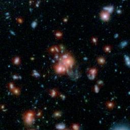 A massive cluster of galaxies, called SpARCS1049+56, can be seen in this multi-wavelength view from NASA's Hubble and Spitzer space telescopes.