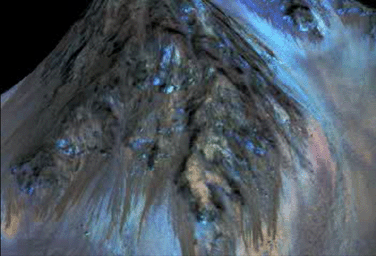 This frame from an animation simulates a fly-around look at one of the places on Mars where dark streaks advance down slopes during warm seasons, possibly involving liquid water. This image is from NASA's Mars Reconnaissance Orbiter.