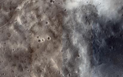 This image from NASA's Mars Reconnaissance Orbiter spacecraft shows the nature of the terrain at the rim of Marth Crater just as a dust storm arrives.