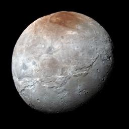 Charon's color palette is not as diverse as Pluto's; most striking is the reddish north (top) polar region, informally named Mordor Macula, as seen by NASA's New Horizons.