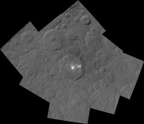 This mosaic shows Ceres' Occator crater and surrounding terrain from an altitude of 915 miles (1,470 kilometers), as seen by NASA's Dawn spacecraft. Occator is 60 miles (90 kilometers) across and 2 miles (4 kilometers) deep.