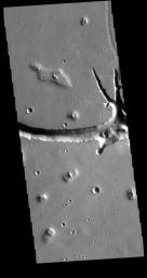 Located west of Elysium Mons, Hephaestus Fossae is a long, complex fracture system, as shown in this image captured by NASA's 2001 Mars Odyssey spacecraft.