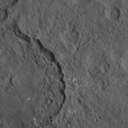 Dantu crater on Ceres, seen in this image from NASA's Dawn spacecraft at left, reveals structures hinting at tectonic processes that formed the dwarf planet's surface. Linear structures are spread over the crater floor.