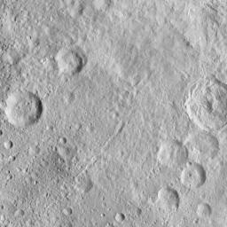 This image, taken by NASA's Dawn spacecraft, displays a linear structure trending from northeast to southwest (lower left to upper right). The graben might be interpreted as a chain of collapsed pits or secondary craters.