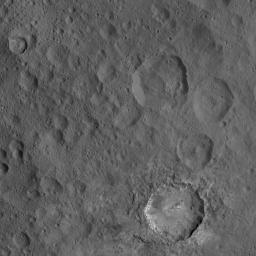 This view from NASA's Dawn spacecraft includes Haulani, a relatively fresh crater 19 miles (31 kilometers) in diameter. The interior of Haulani shows landslides from its crater rim, along with smooth material and a central ridge on its crater floor.