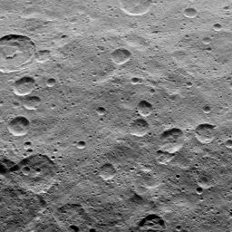 This view of Ceres from NASA's Dawn spacecraft shows Tupo Crater (22 miles, 36 kilometers wide), at upper left, with its sharp rim and prominent central peak.