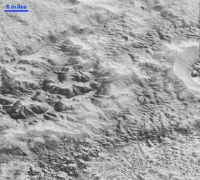 This highest-resolution image from NASA's New Horizons spacecraft shows how erosion and faulting has sculpted this portion of Pluto's icy crust into rugged badlands.