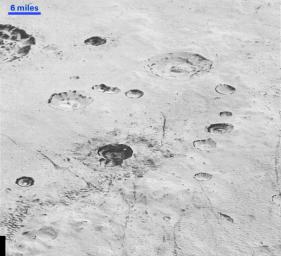 This highest-resolution image from NASA's New Horizons spacecraft reveals new details of Pluto's rugged, icy cratered plains.