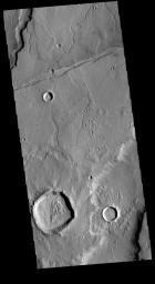 This image captured by NASA's 2001 Mars Odyssey spacecraft shows part of Tempe Terra. Both channels and graben are visible in this image.