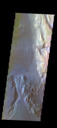 The THEMIS camera contains 5 filters. The data from different filters can be combined in multiple ways to create a false color image. This image from NASA's 2001 Mars Odyssey spacecraft shows part of the floor of Gale Crater, home of the Curiosity Rover.