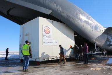 Personnel supporting NASA's InSight mission to Mars load the crated InSight spacecraft into a C-17 cargo aircraft at Buckley Air Force Base, Denver, for shipment to Vandenberg Air Force Base, California.