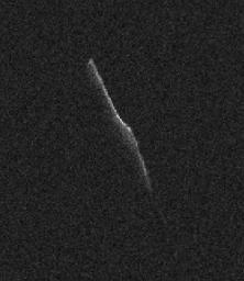 The elongated asteroid in this radar image, named 2003 SD220, will safely fly past Earth on Dec. 24, 2015, at a distance of 6.8 million miles (11 million kilometers).