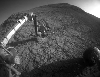 The target beneath the tool turret at the end of the rover's robotic arm in this image from NASA's Mars Exploration Rover Opportunity is 'Private John Potts,' which slices through the western rim of Endeavour Crater.
