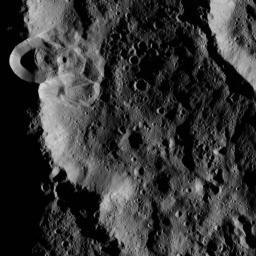 This image, taken by the framing camera aboard NASA's Dawn spacecraft, shows several unnamed craters superimposed upon one another. The low sun angle enhances the topography of this densely cratered region.