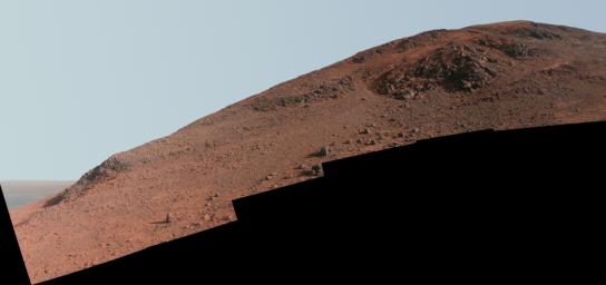This scene in enhanced color from NASA's Mars Exploration Rover Opportunity looks upward at 'Knudsen Ridge' on the southern edge of 'Marathon Valley' from inside the valley.
