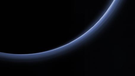 This approximate true-color image from NASA's New Horizons shows hydrocarbons accumulating into small particles, a fraction of a micrometer in size, and scatter sunlight to make the bright blue haze seen in this image.
