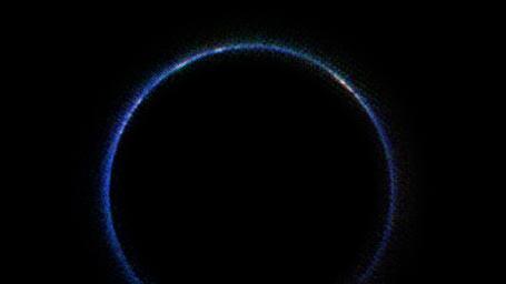 This image from NASA's New Horizons spacecraft is the first look at Pluto's atmosphere in infrared wavelengths. The blue ring around Pluto is caused by sunlight scattering from haze particles common in Pluto's atmosphere.